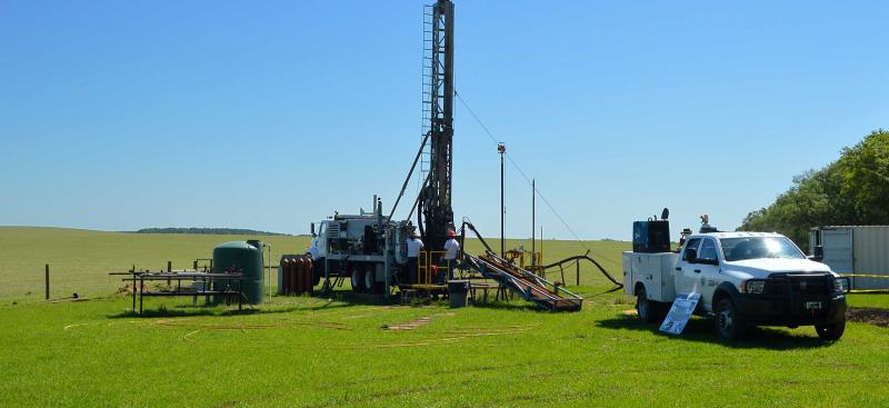 District well drilling rig and truck