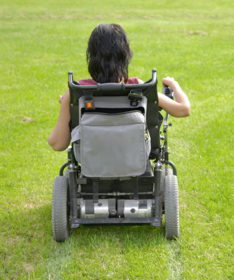 Woman outdoors in wheelchair