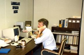 Staff using 1980 computer and phone