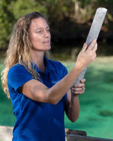 Professional Geologist Kristina Mallams examining samples on the Weeki Wachee.