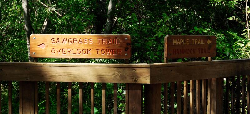 trail signs on boardwalk