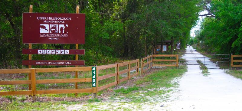 sign, fence, gate at park entrance