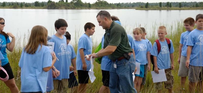 Students in the field with District staff