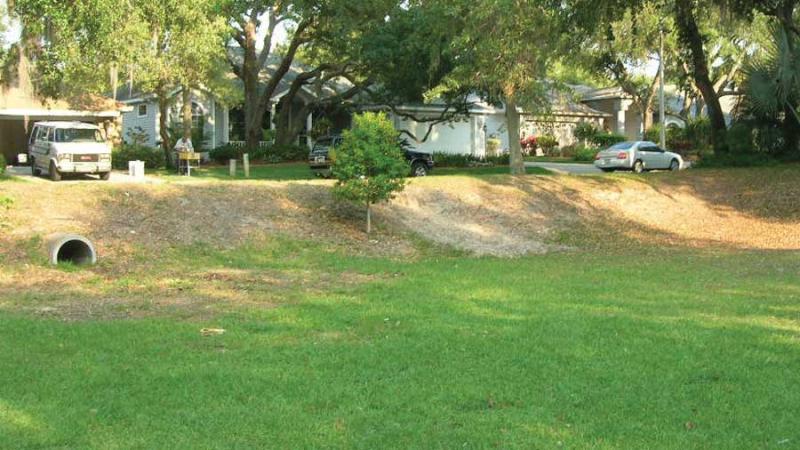 A dry grassy retention area