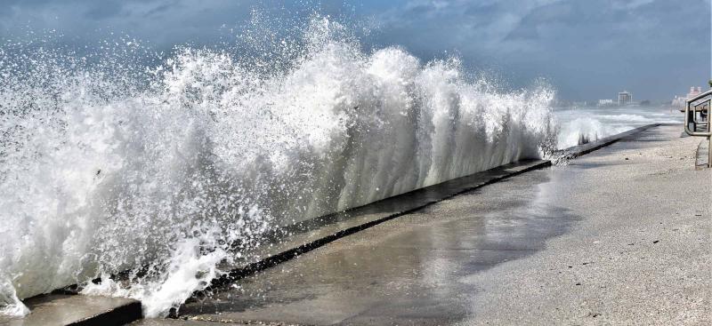 Waves crashing against a seawall in St. Pete.