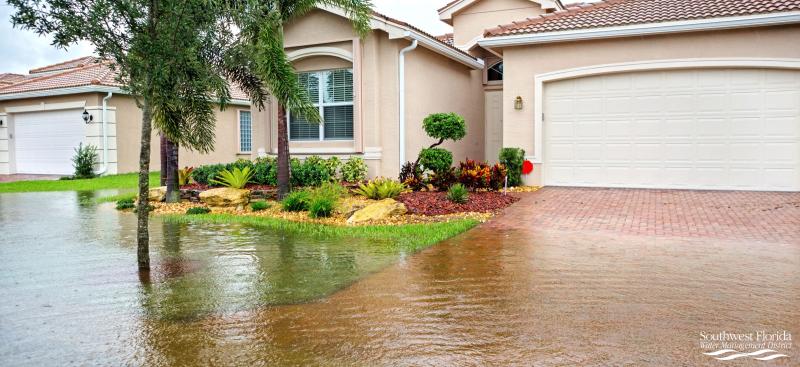 Image of a Florida home with their front yard flooded
