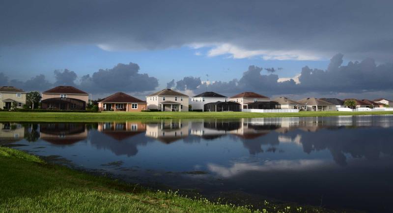 A new development of homes on a retention pond