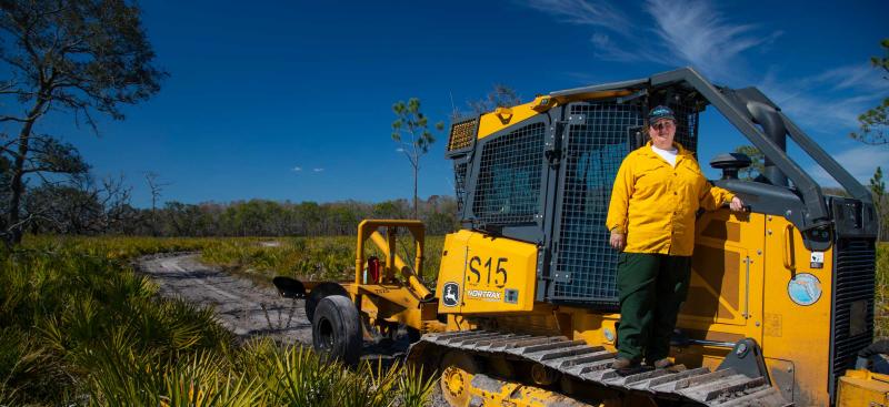 District staff on bulldozer