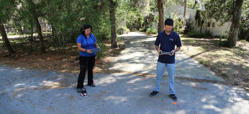 Two District staffers testing for water leaks