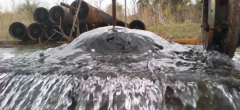 water flowing out during a back-plugging