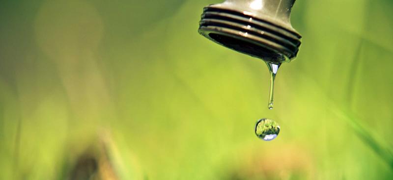 water dripping out of a faucet