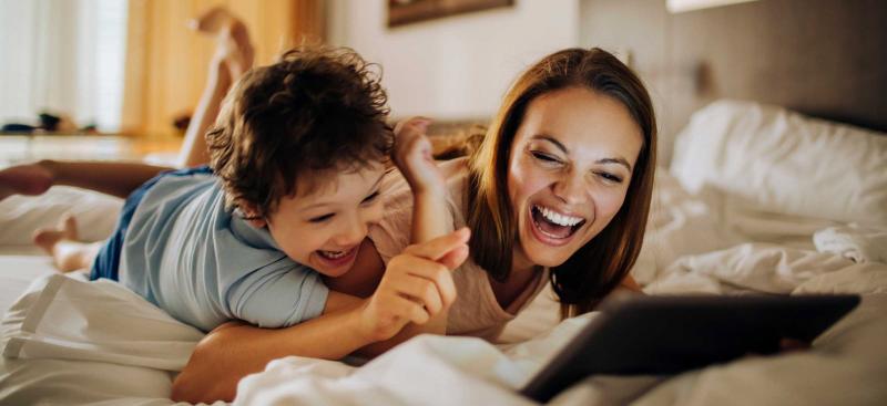 Family on hotel bed