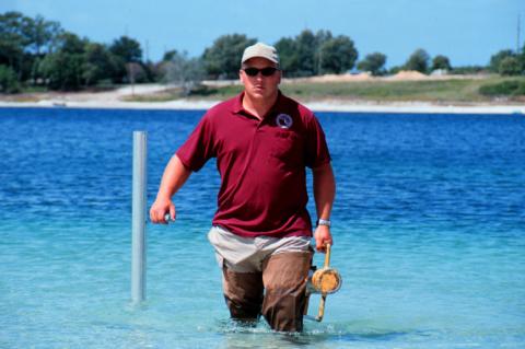 District staff in a water body