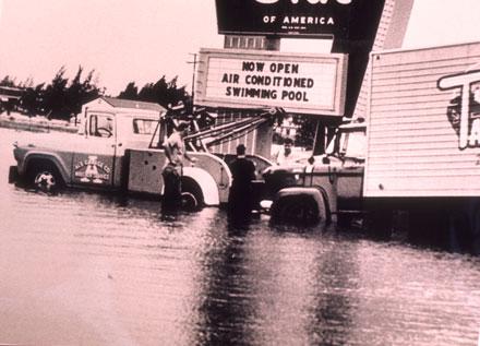 Trucks in flooded Dale Mabry Highway, 1960