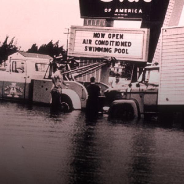 Trucks in flooded Dale Mabry Highway, 1960