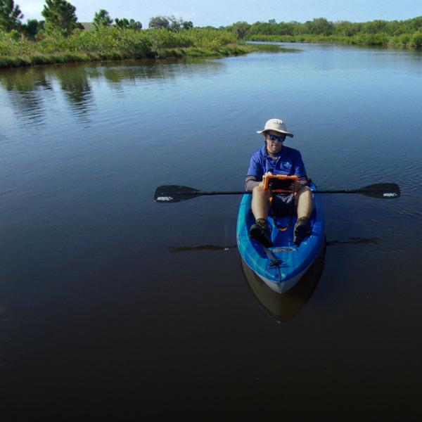 District scientist in kayak collecting water data