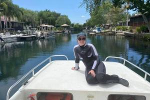 Madison Trowbridge sitting on a boat