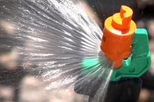 Close up of in-ground lawn sprinkler