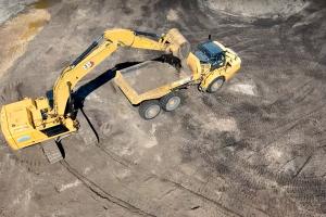 Excavator and dump truck