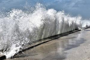 Waves crashing against a seawall in St. Pete.