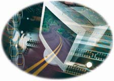 Montage of a computer monitor, circut board and a winding highway road.