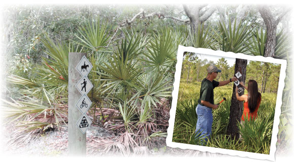 Staff marking District trails