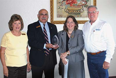 Staff and Governing Board members accept award