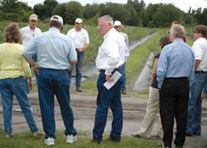 Staff and Board members tour a FARMS project