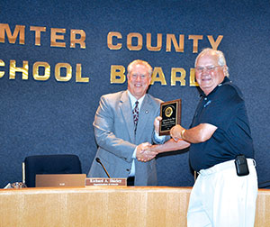 Doug Tharp accepting award from Richard Shirley