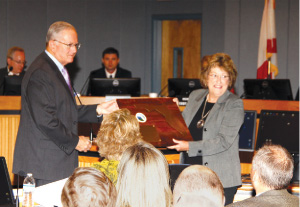 Judy Whitehead receiving plaque.