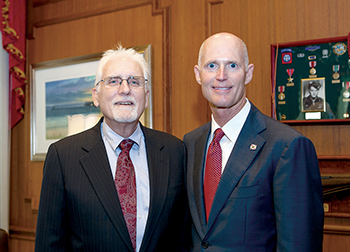 George Mann and Gov. Rick Scott.